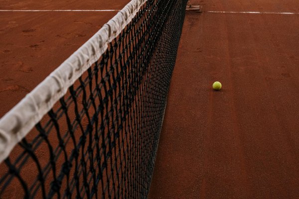 What are the best strength training exercises for enhancing the power of a tennis serve?